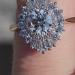 Load and play video in Gallery viewer, Simon G. Round Cut Supernova Diamond Baguette Halo Engagement Ring
