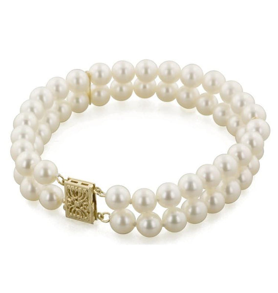 Modernist Baroque Pearl , Gold and Diamond Double Strand Pearl Bracelet at  1stDibs